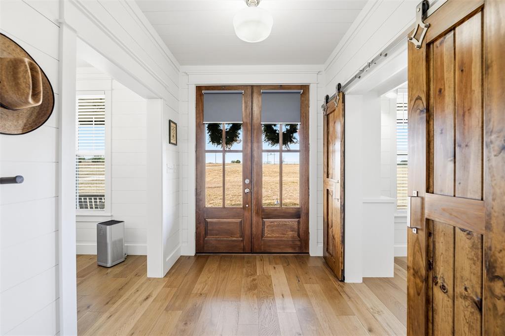245 La Cresta Lane Perrin, TX 76486 - Photo 4 of 40 wooden floor in an empty room and a bathroom