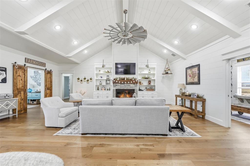 245 La Cresta Lane Perrin, TX 76486 - Photo 6 of 40 a living room with furniture and a fireplace