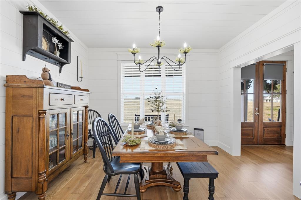 245 La Cresta Lane Perrin, TX 76486 - Photo 8 of 40 a view of a dining room with furniture window and wooden floor