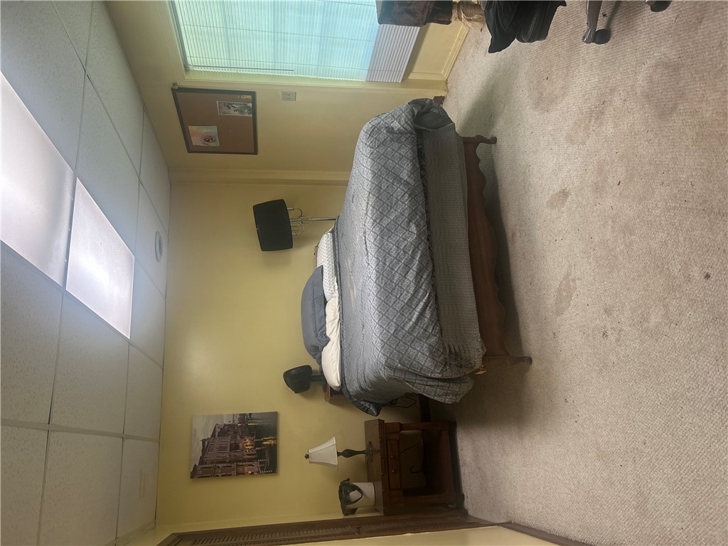 418 Saluda Road Williamston, SC 29697 - Photo 11 of 40 A comfortable bedroom featuring soft carpet and a window for natural light.