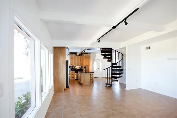 a view of main area with wooden floor and furniture