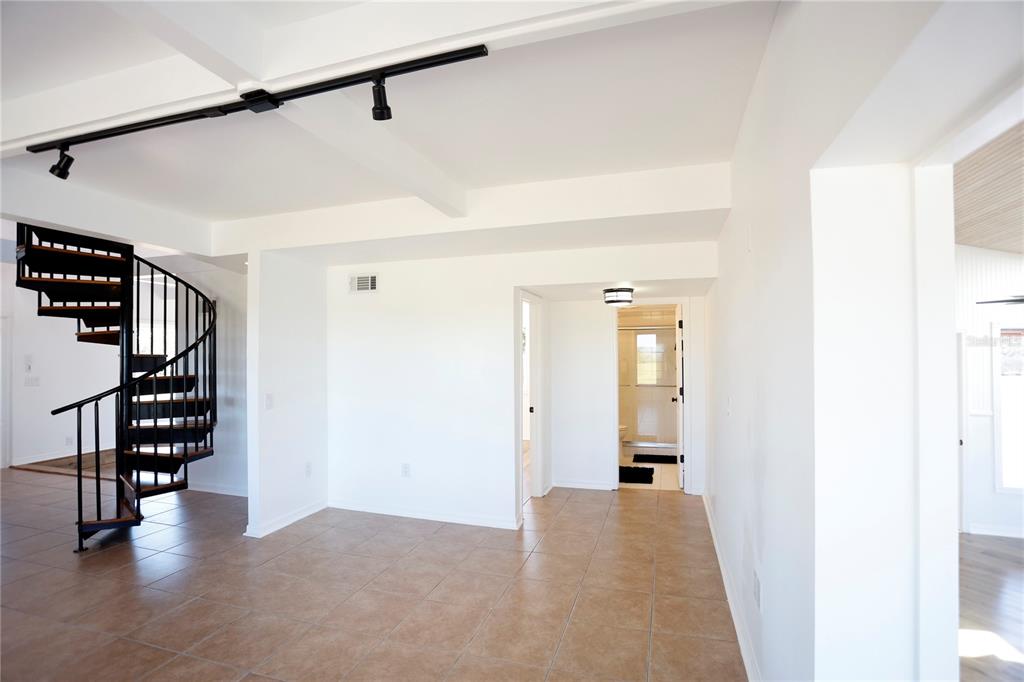 3194 Indian Gulf Lane Spring Hill, FL 34607 - Photo 13 of 38 a view of a hallway with wooden floor and entryway