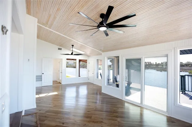 a view of an entryway with wooden floor