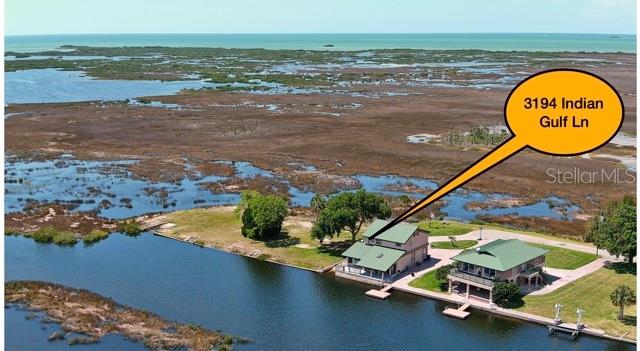 3194 Indian Gulf Lane Spring Hill, FL 34607 - Photo 2 of 38 a view of a swimming pool with a outdoor space