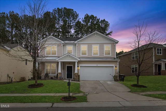 front view of a house with a yard