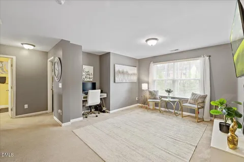 a room with a chair and gym equipment