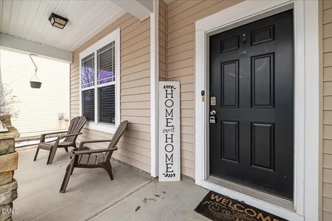 a view of a livingroom with furniture and a window