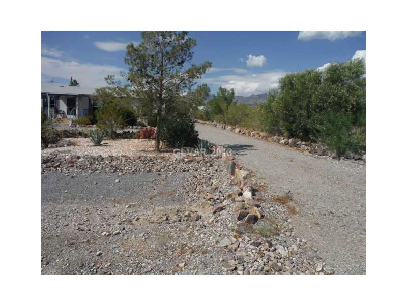 880 East Country Place Road Pahrump, NV 89060 - Photo 4 of 4 Property Photo. View of west side drive around