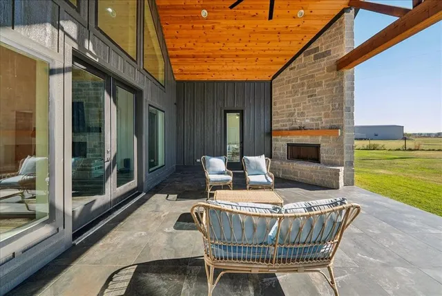 a view of a chair and table in the balcony