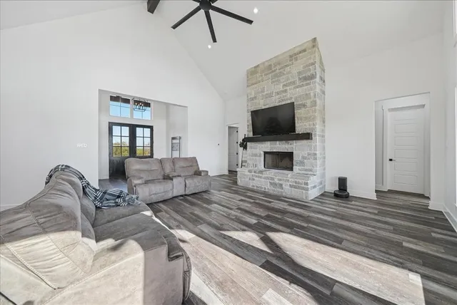 a living room with furniture fireplace and a flat screen tv