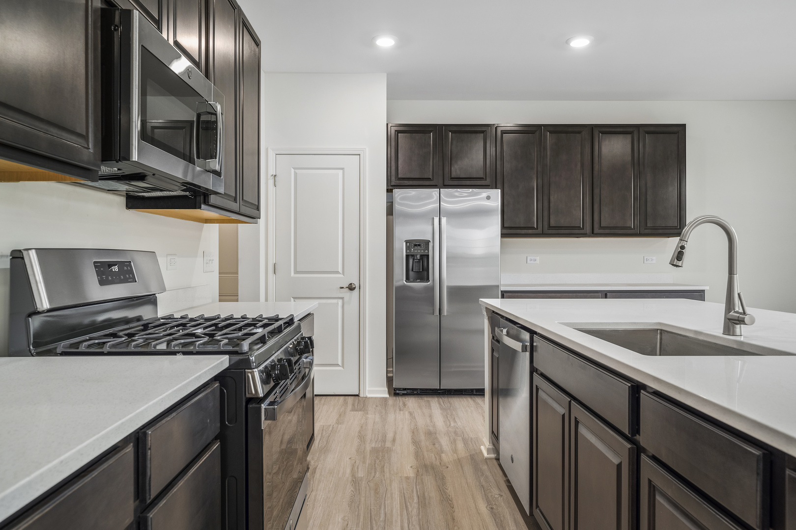 3668 Edelweiss Road Elgin, IL 60124 - Photo 12 of 23 a kitchen with stainless steel appliances granite countertop a sink stove and refrigerator