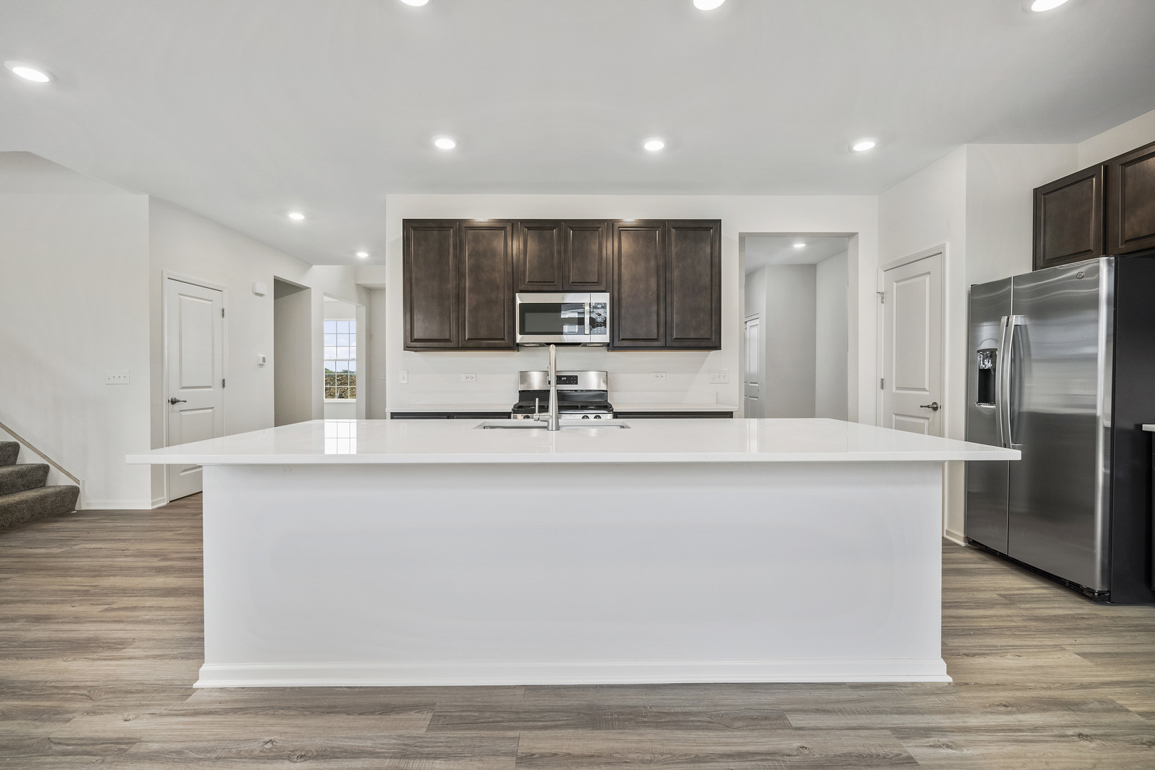 3668 Edelweiss Road Elgin, IL 60124 - Photo 14 of 23 a view of kitchen with stainless steel appliances granite countertop a sink a stove and a refrigerator