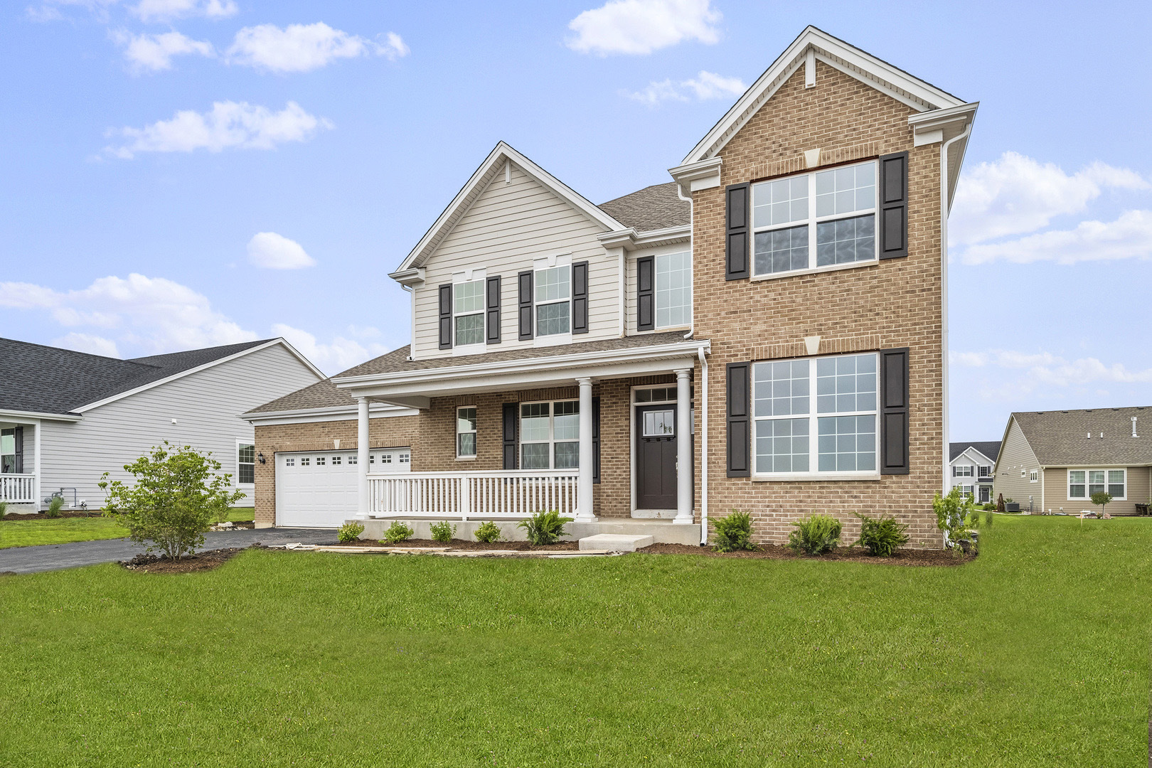 3668 Edelweiss Road Elgin, IL 60124 - Photo 2 of 23 a front view of a house with a yard