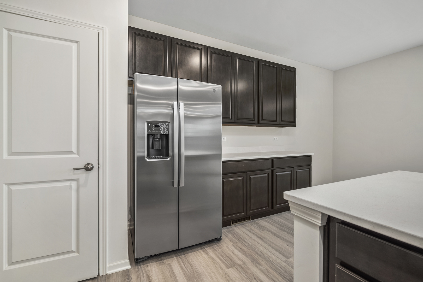 3668 Edelweiss Road Elgin, IL 60124 - Photo 10 of 23 a kitchen with a refrigerator sink and cabinets