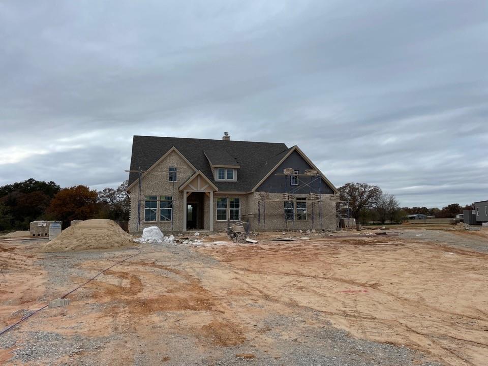 150 Chester Road Springtown, TX 76082 - Photo 1 of 1 a front view of a house with a yard