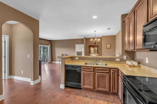 a kitchen with a stove and a sink