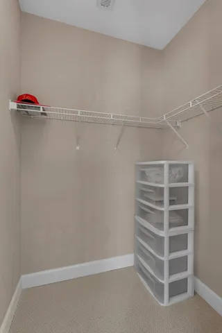 a view of a wooden balcony with a yard