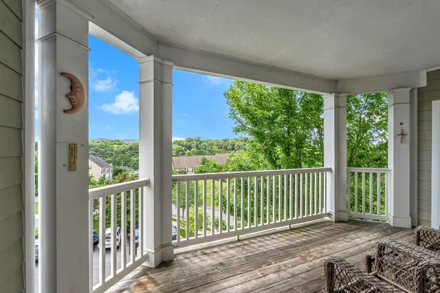 a view of balcony with furniture