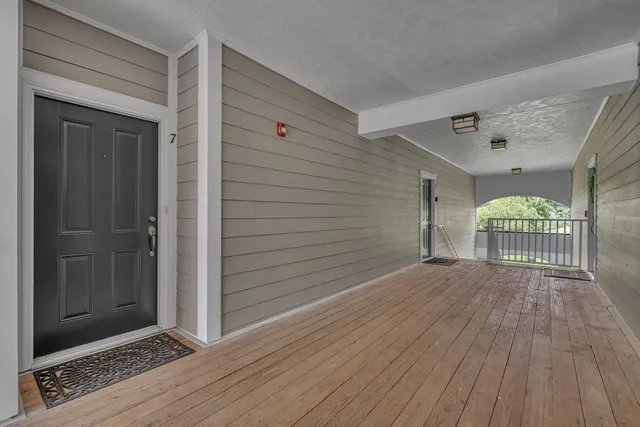 a view of entryway with wooden floor