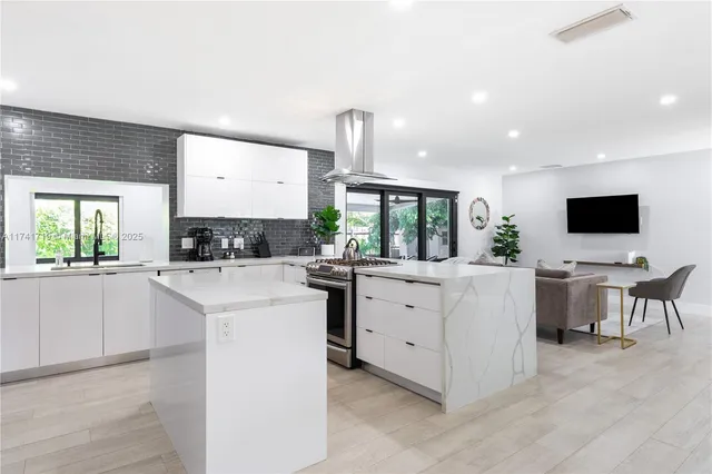 a kitchen with counter top space cabinets and stainless steel appliances