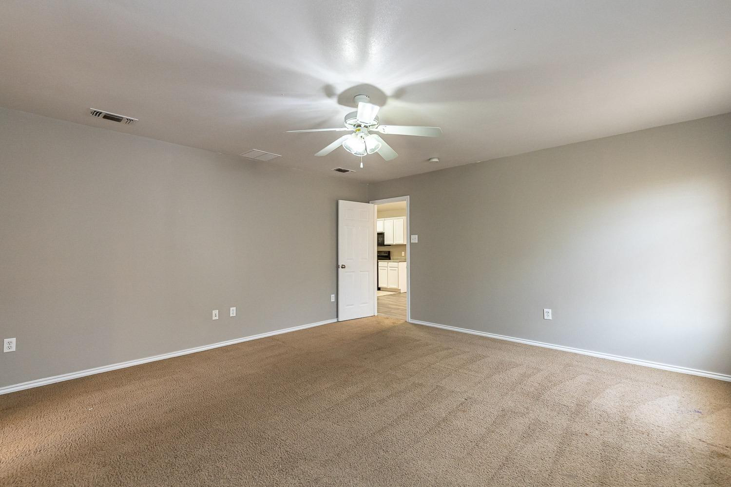 2006 100th Street Lubbock, TX 79423 - Photo 15 of 31 a view of an empty room with a window