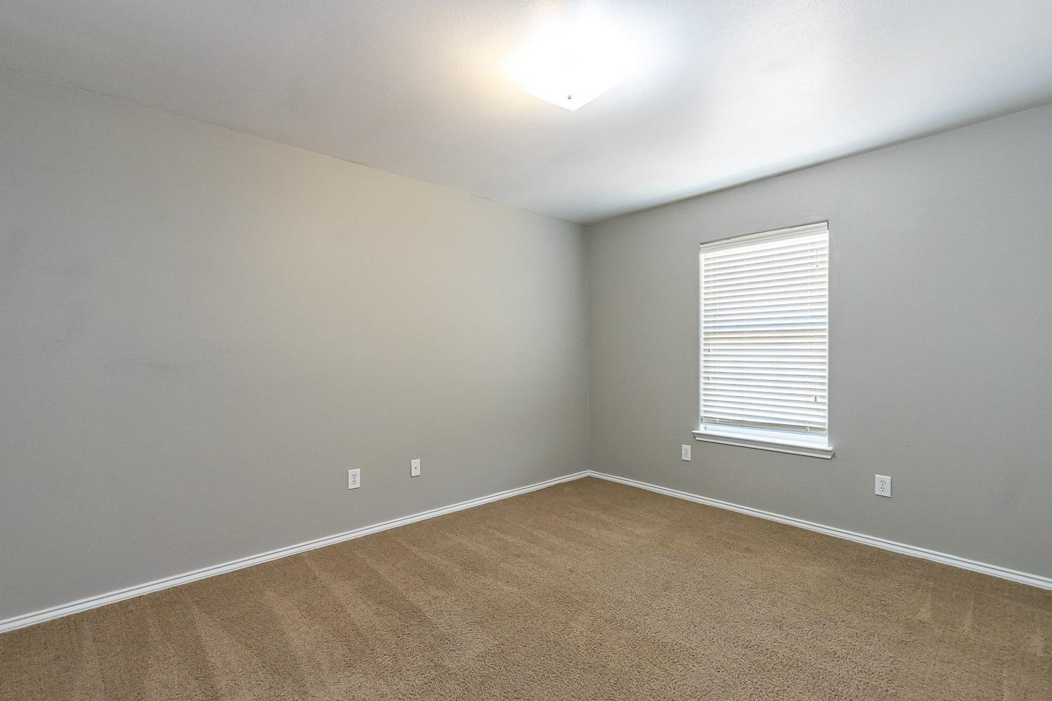 2006 100th Street Lubbock, TX 79423 - Photo 26 of 31 an empty room with a window