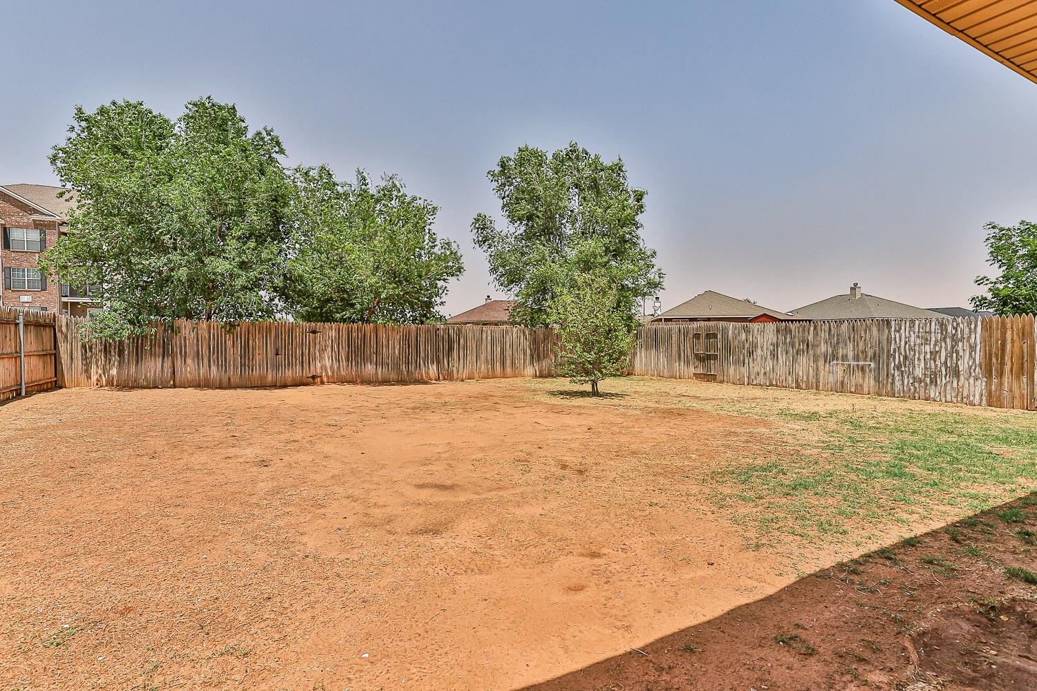 2006 100th Street Lubbock, TX 79423 - Photo 30 of 31 a swimming pool with wooden fence