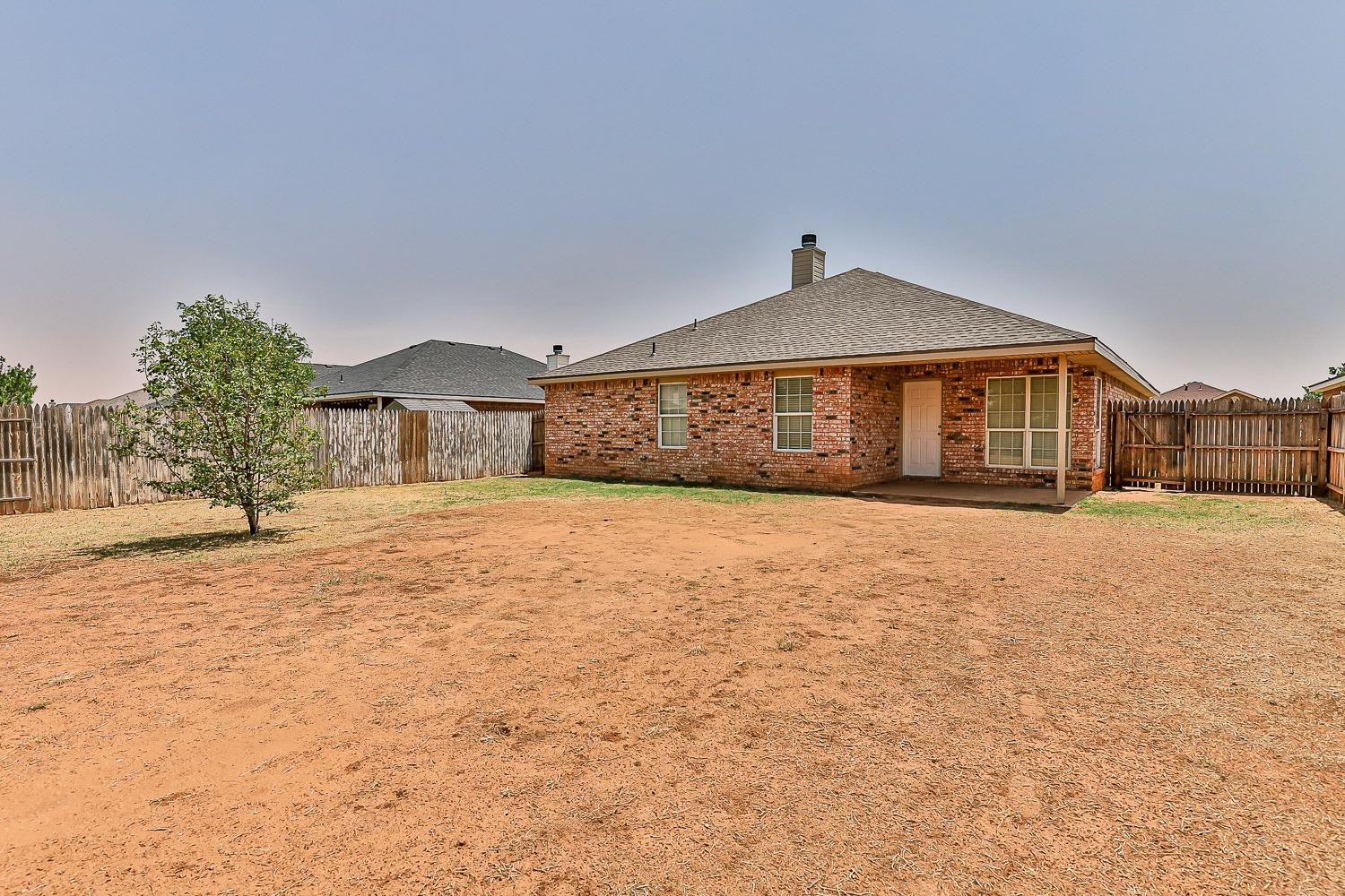 2006 100th Street Lubbock, TX 79423 - Photo 31 of 31 a front view of a house with a yard