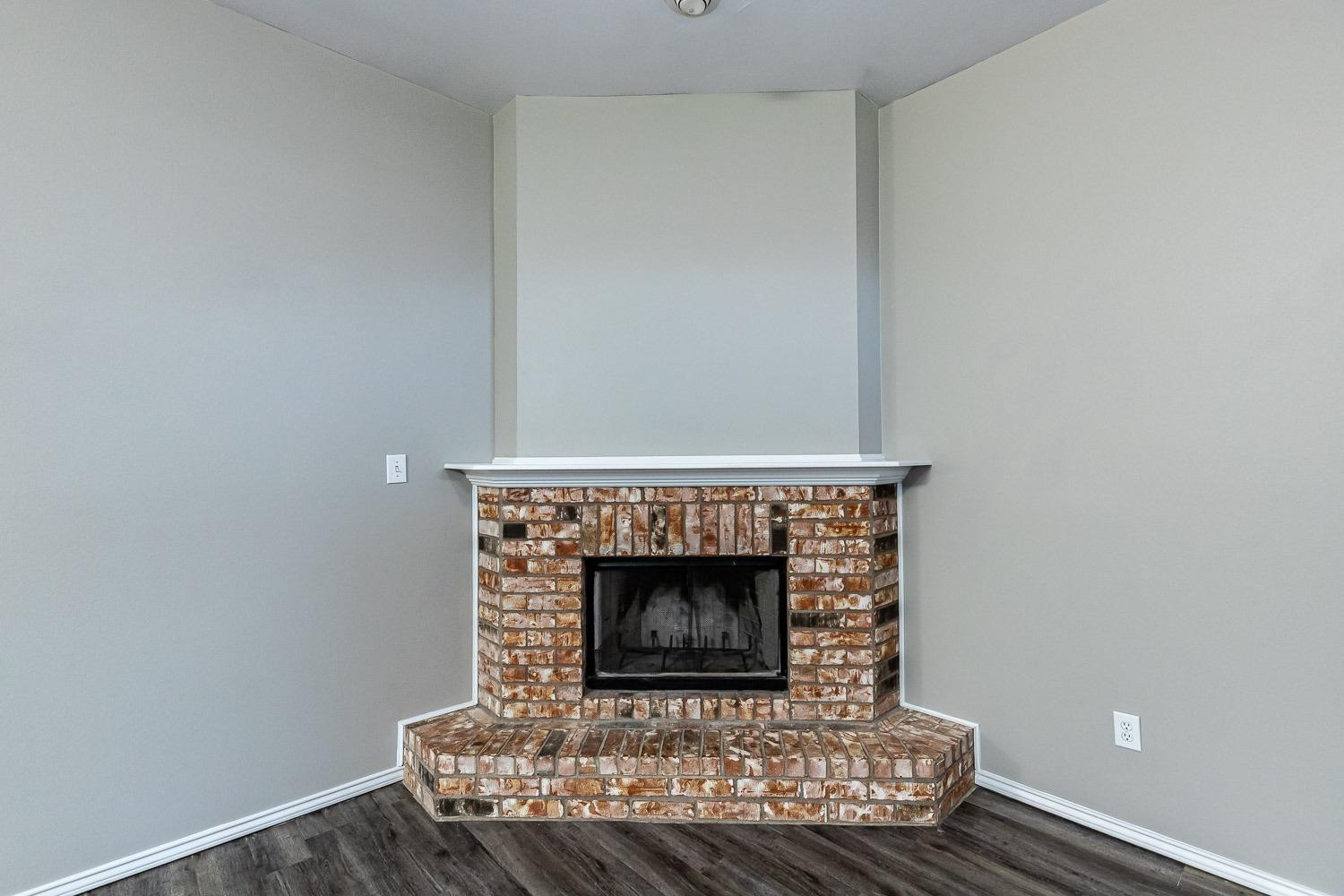 2006 100th Street Lubbock, TX 79423 - Photo 5 of 31 a room with a fireplace