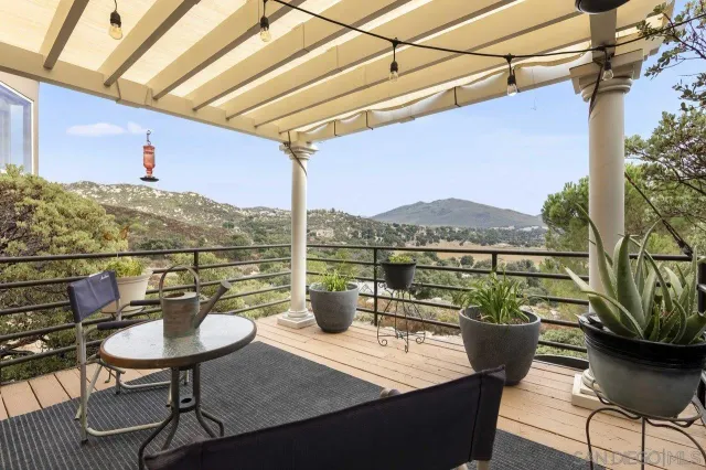 a view of a chairs and table in the patio