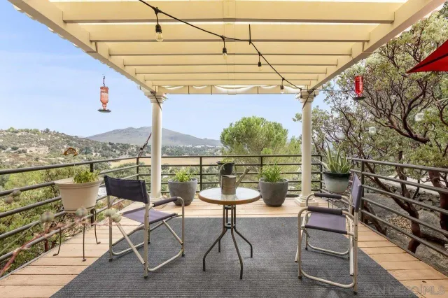 a view of a chairs and table in the terrace