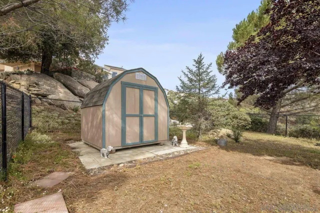 a view of a house with a snow in the yard