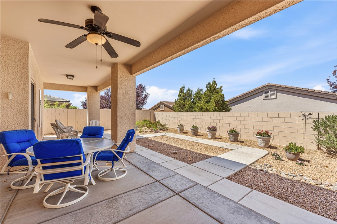 3315 Rainbow Mine Road Kingman, AZ 86401 - Photo 40 of 54 The property features a covered patio with a ceiling fan, offering a comfortable outdoor living space