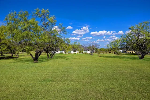 a view of a building and trees