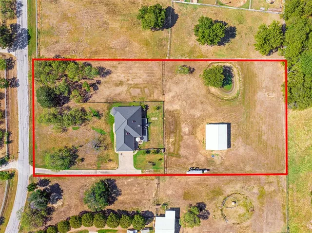 a view of a yard with an outdoor seating