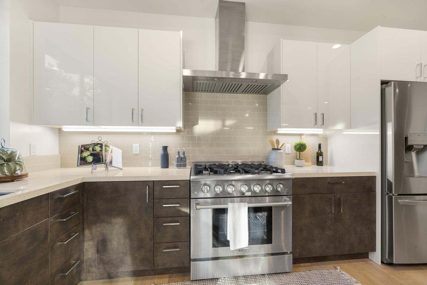 1009 Cascade Drive Sunnyvale, CA 94087 - Photo 20 of 89 a kitchen with stainless steel appliances granite countertop a stove a refrigerator and a sink