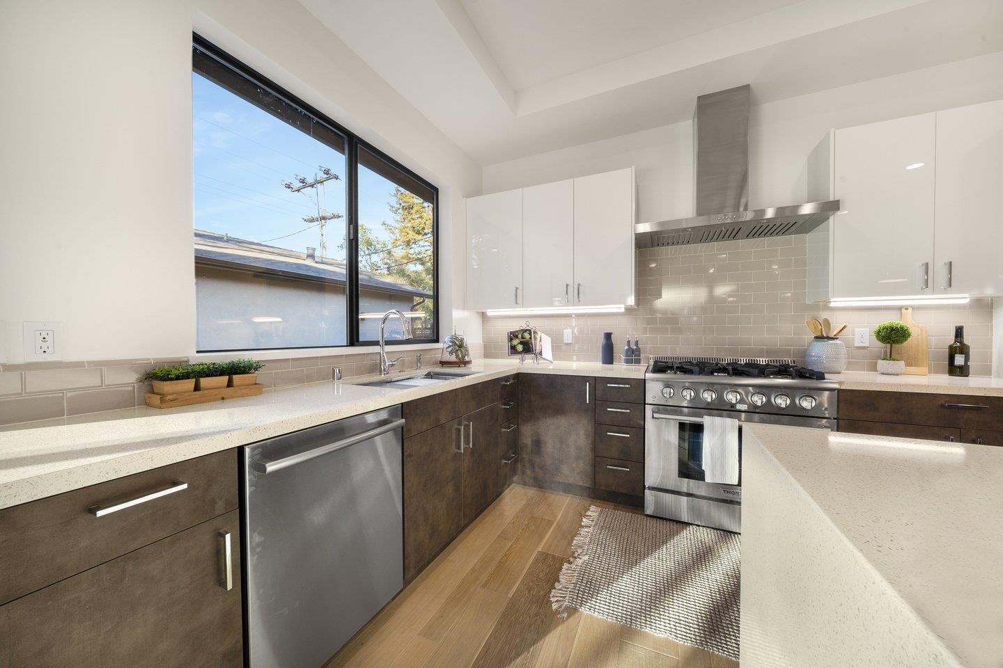 1009 Cascade Drive Sunnyvale, CA 94087 - Photo 21 of 89 a kitchen with stainless steel appliances granite countertop a sink stove and refrigerator
