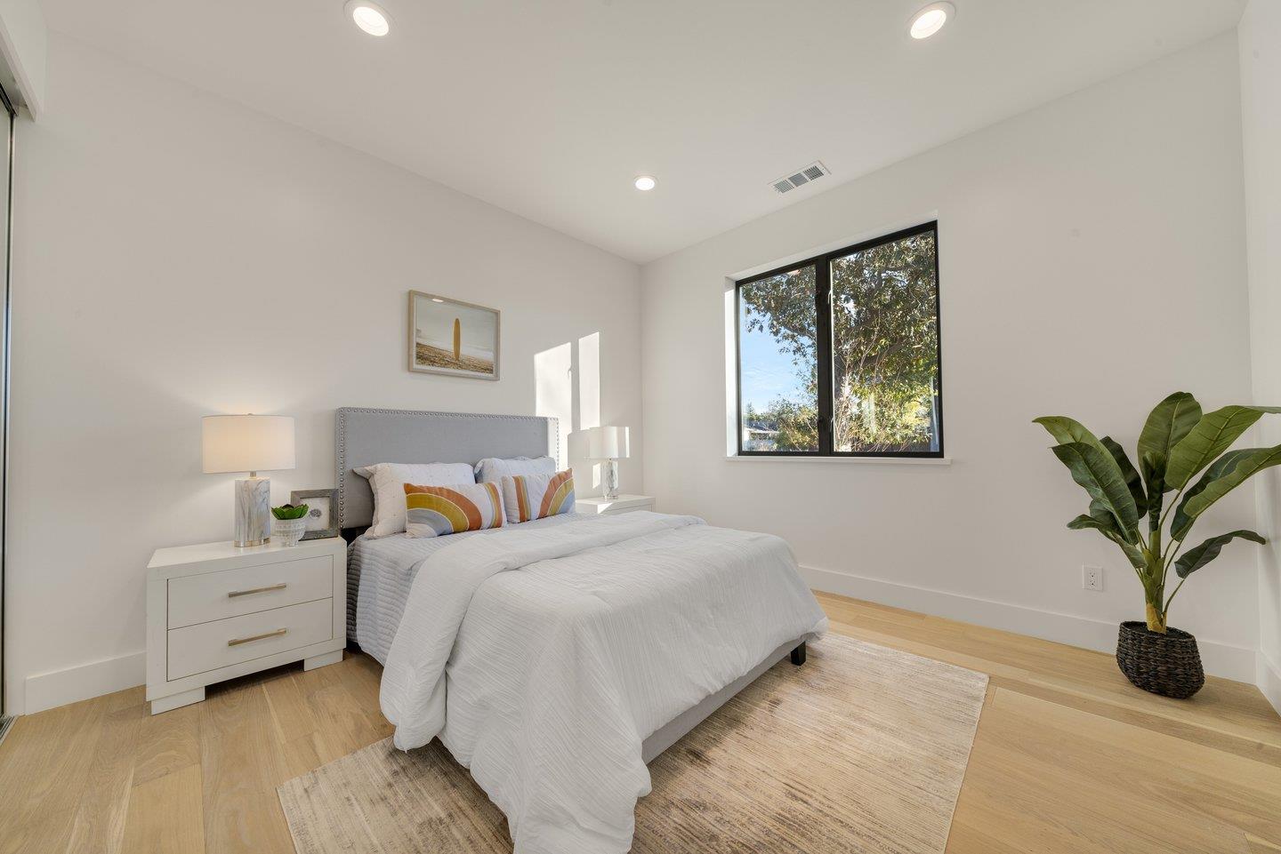 1009 Cascade Drive Sunnyvale, CA 94087 - Photo 29 of 89 a bedroom with bed and a potted plant