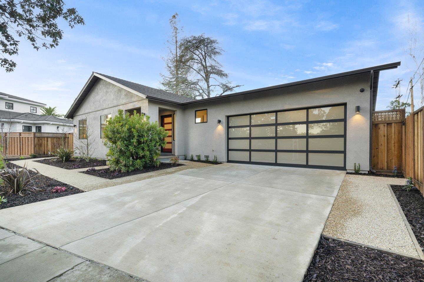 1009 Cascade Drive Sunnyvale, CA 94087 - Photo 3 of 89 a front view of a house with a yard and garage
