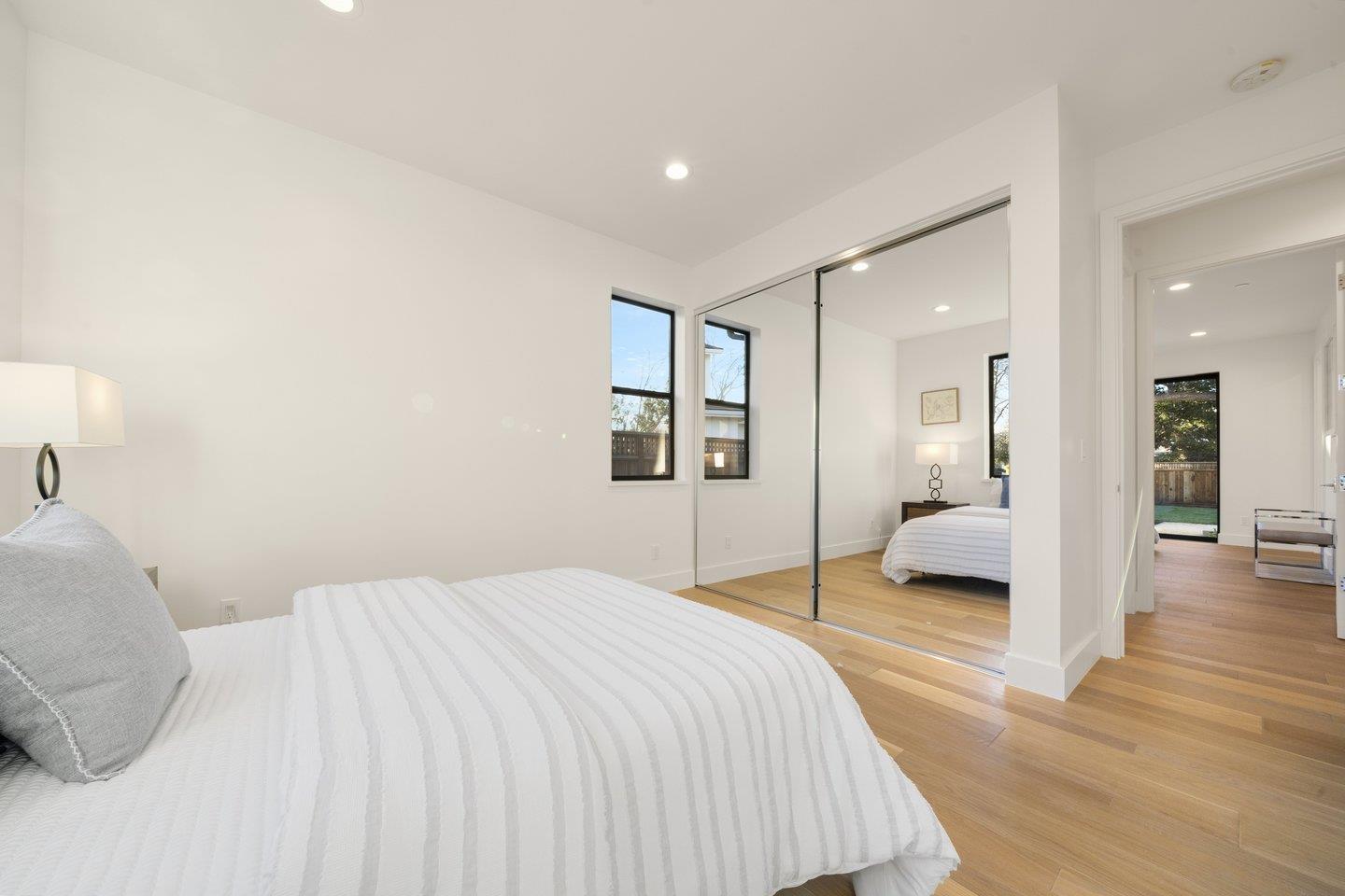 1009 Cascade Drive Sunnyvale, CA 94087 - Photo 32 of 89 a bedroom with a large bed and a large mirror