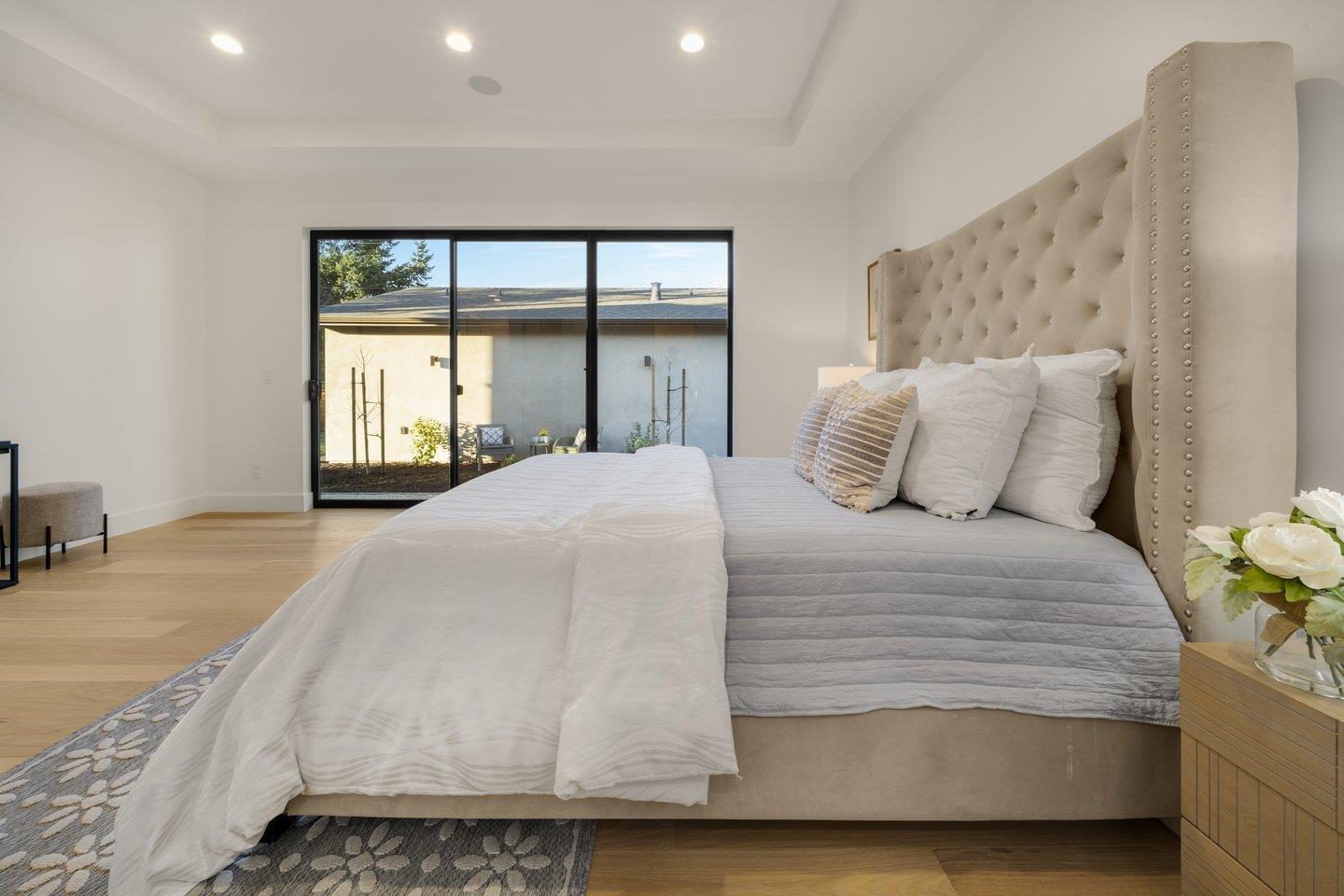 1009 Cascade Drive Sunnyvale, CA 94087 - Photo 44 of 89 a bedroom with a bed and a large window