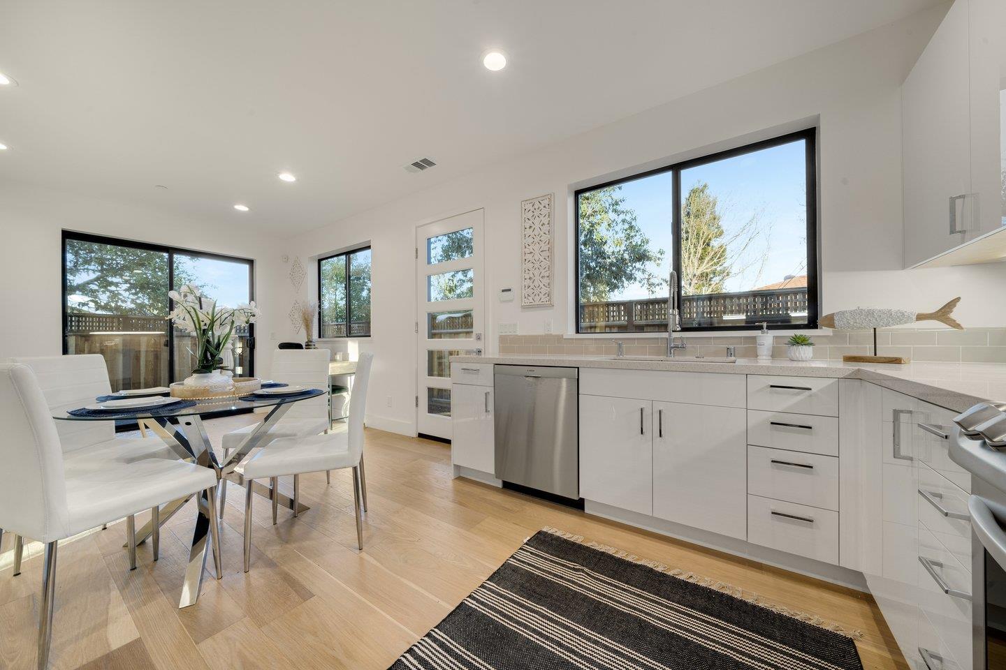 1009 Cascade Drive Sunnyvale, CA 94087 - Photo 60 of 89 a kitchen with a table chairs stove and cabinets