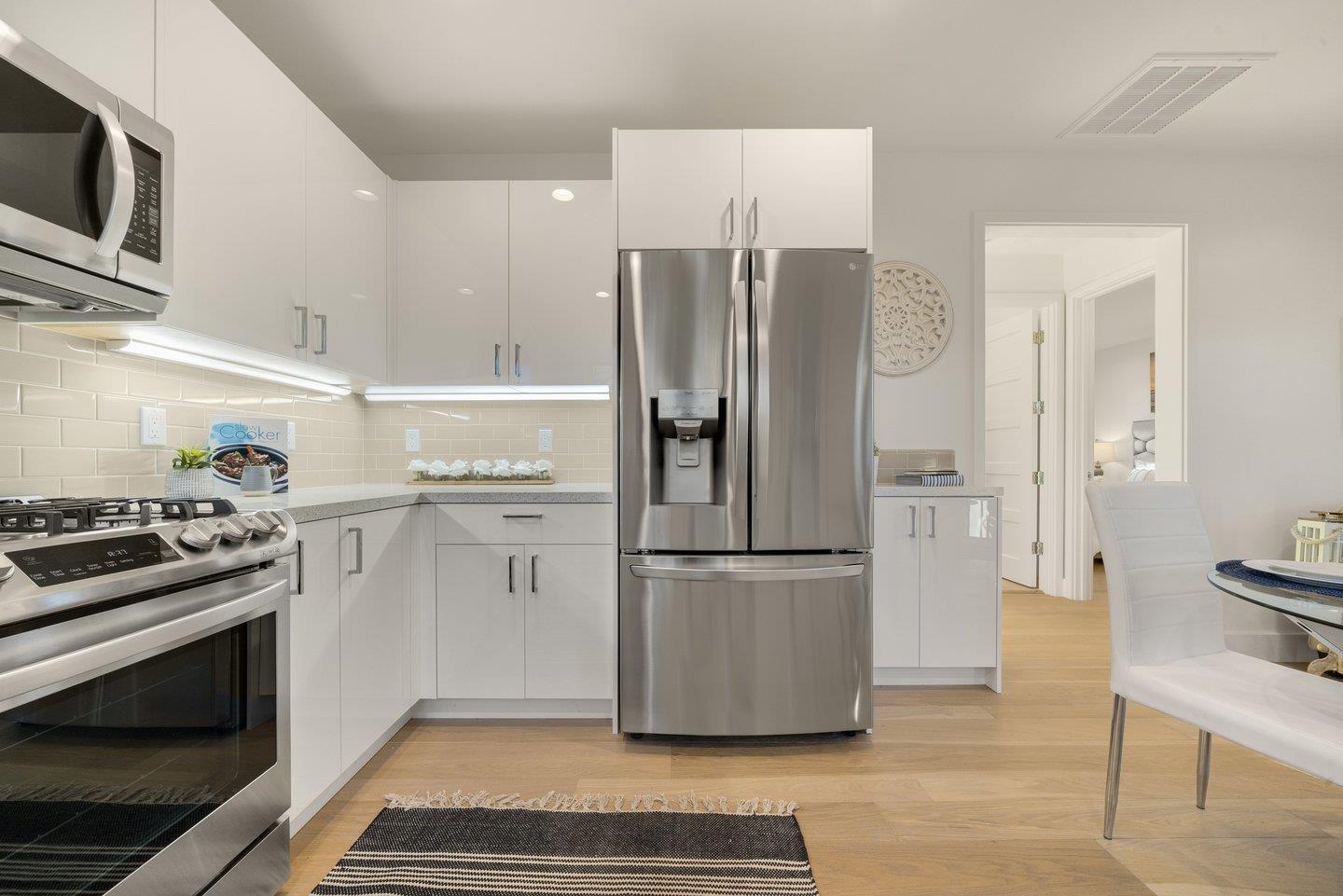 1009 Cascade Drive Sunnyvale, CA 94087 - Photo 64 of 89 a kitchen with stainless steel appliances a refrigerator stove and microwave