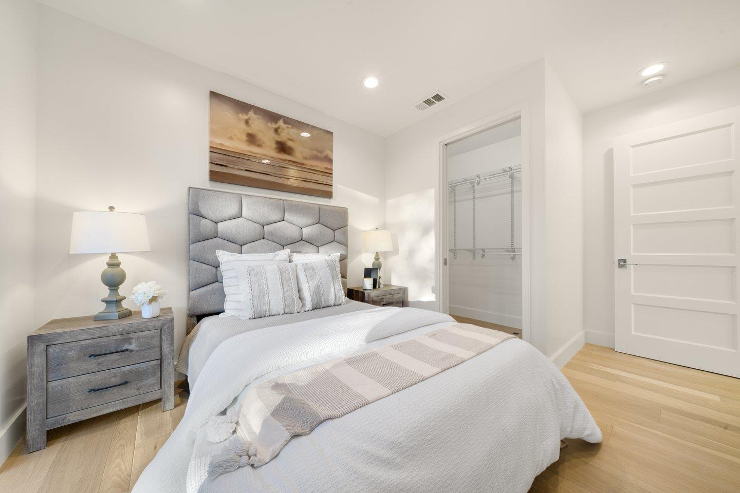 1009 Cascade Drive Sunnyvale, CA 94087 - Photo 66 of 89 a bedroom with a bed and a painting on the wall