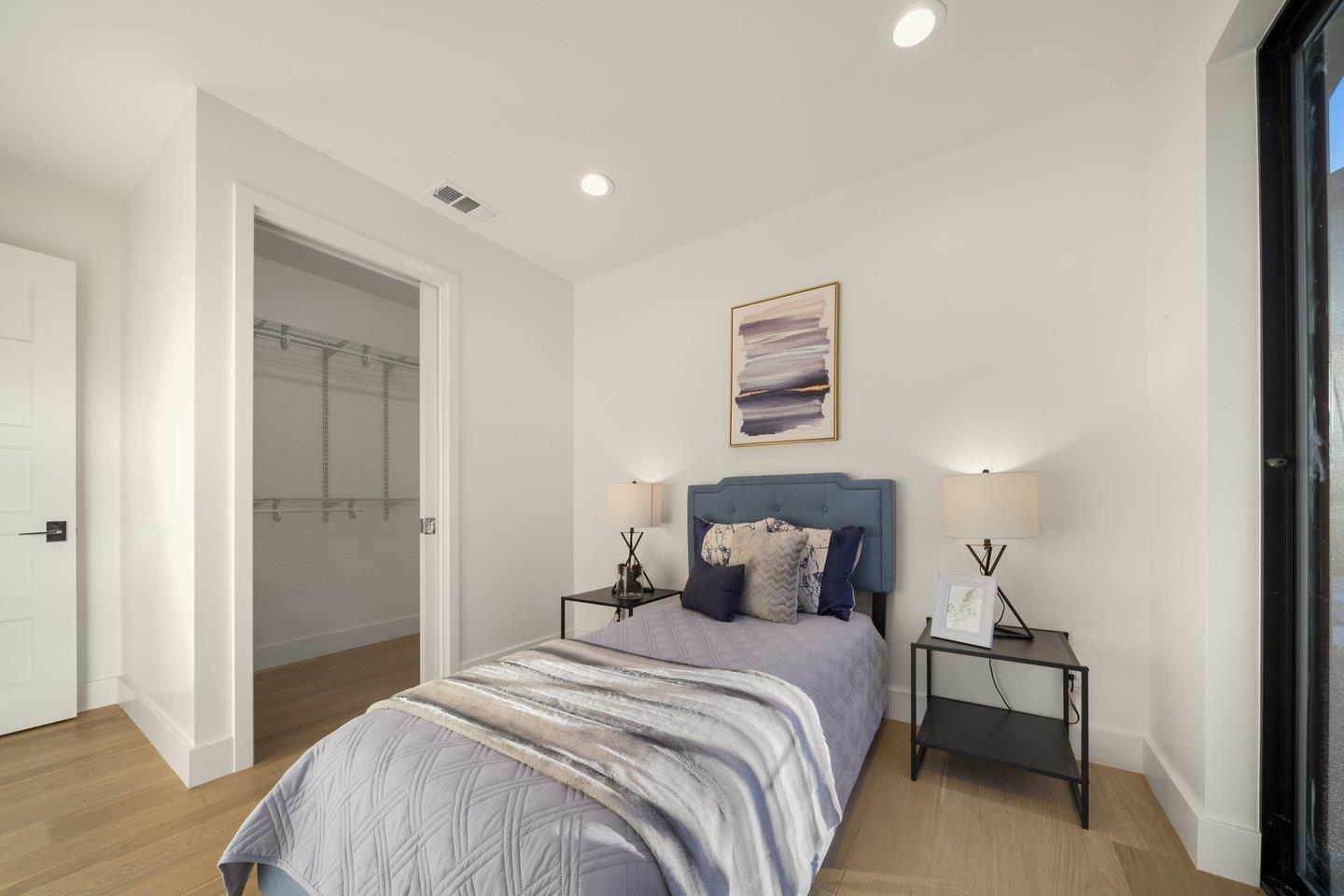 1009 Cascade Drive Sunnyvale, CA 94087 - Photo 67 of 89 a bedroom with a bed and a night stand