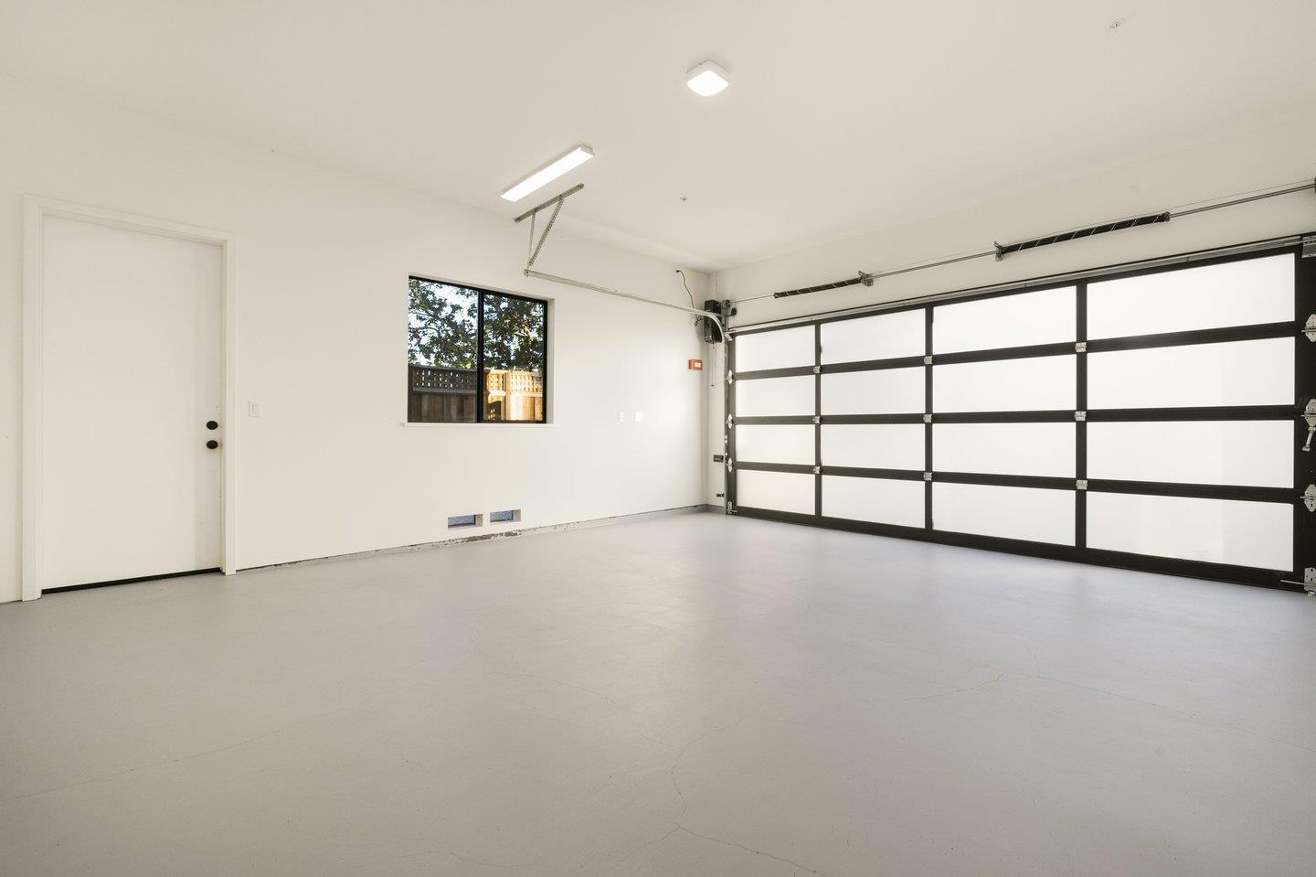 1009 Cascade Drive Sunnyvale, CA 94087 - Photo 73 of 89 an empty room with windows and cabinet