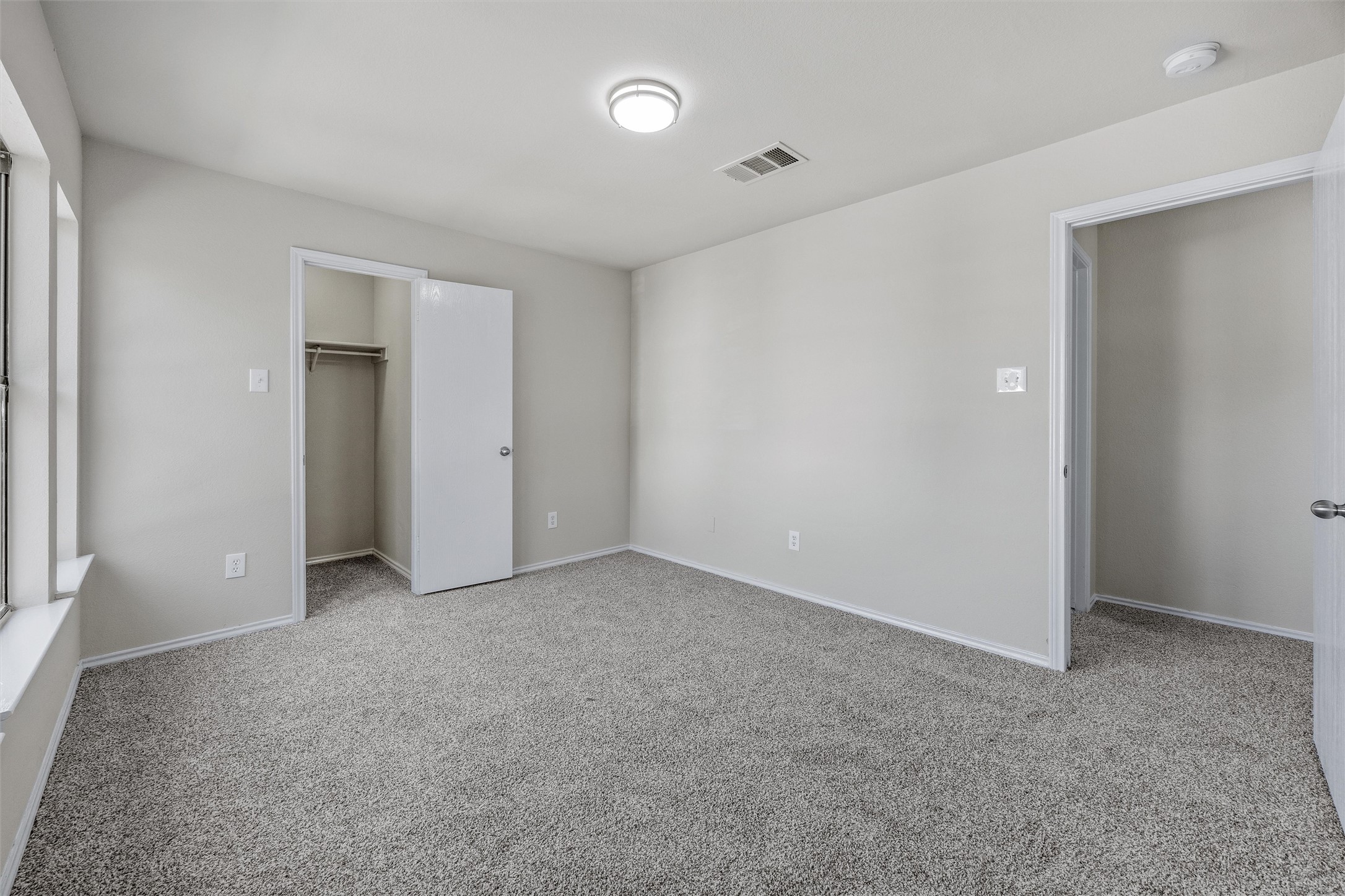 7541 Redrick Drive Austin, TX 78747 - Photo 36 of 40 Unfurnished bedroom featuring a spacious closet, visible vents, baseboards, carpet, and a closet
