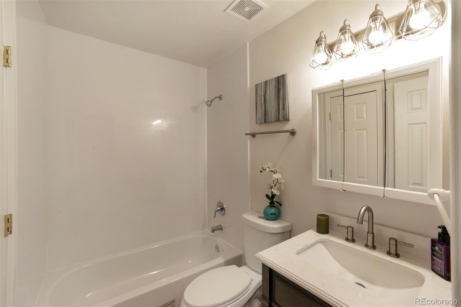 9575 Carr Street Westminster, CO 80021 - Photo 17 of 25 a bathroom with a sink toilet and shower