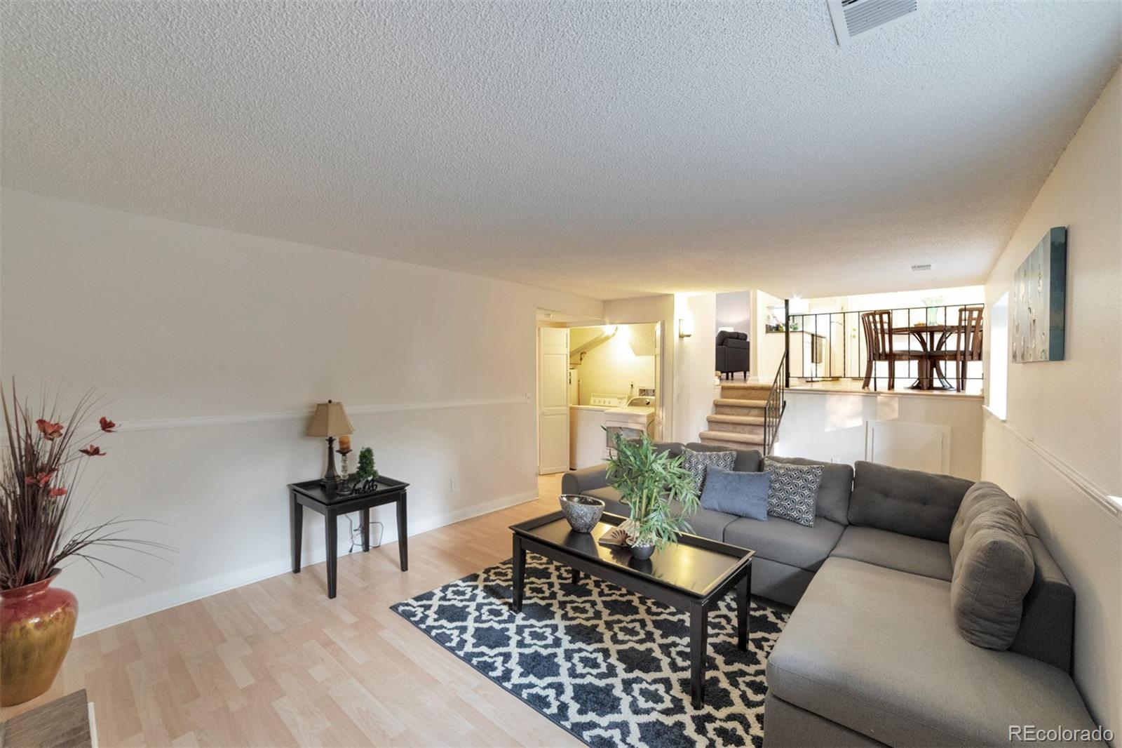 9575 Carr Street Westminster, CO 80021 - Photo 6 of 25 a living room with furniture and wooden floor