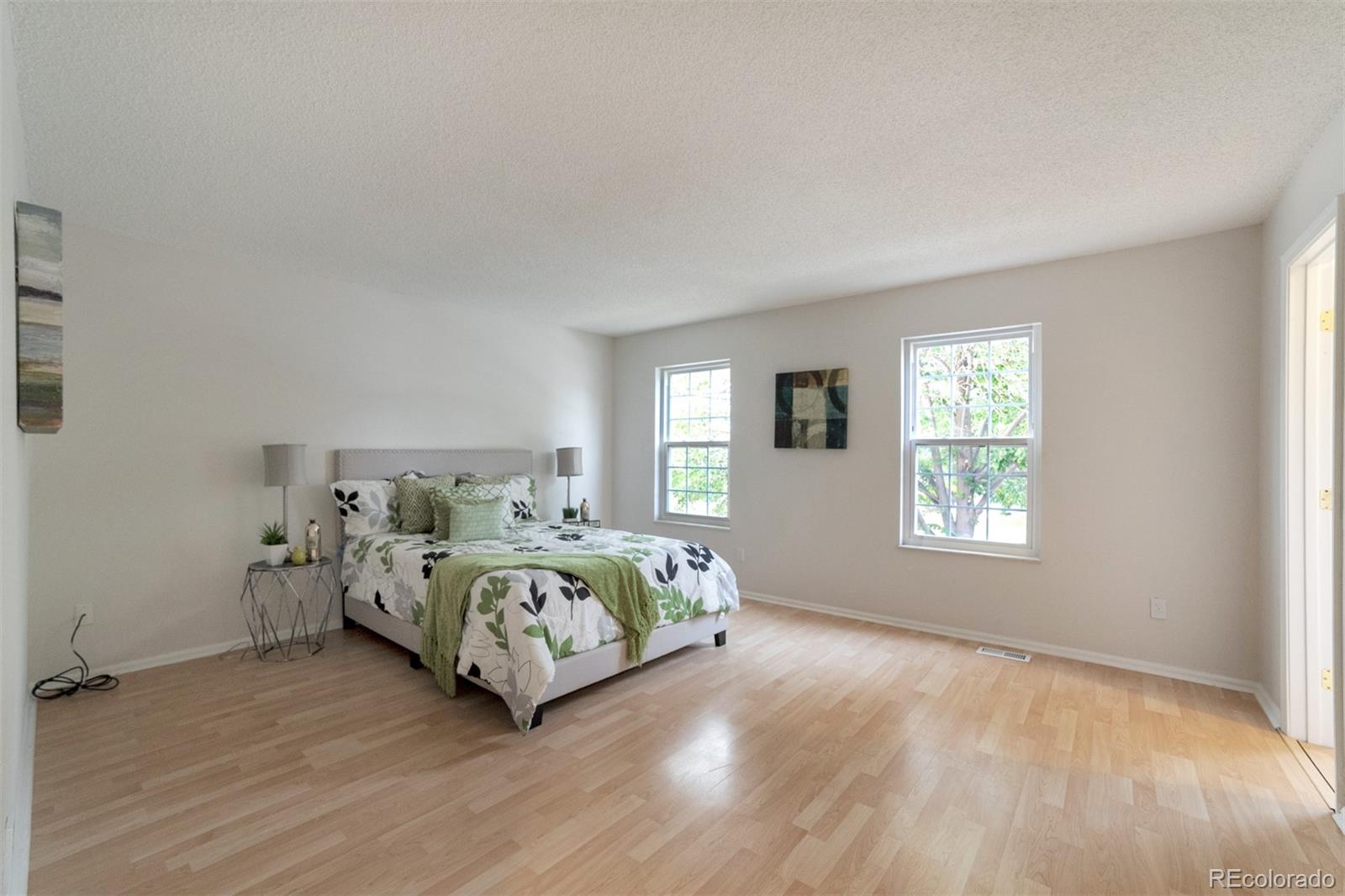 9575 Carr Street Westminster, CO 80021 - Photo 10 of 25 a bedroom with a bed and a window